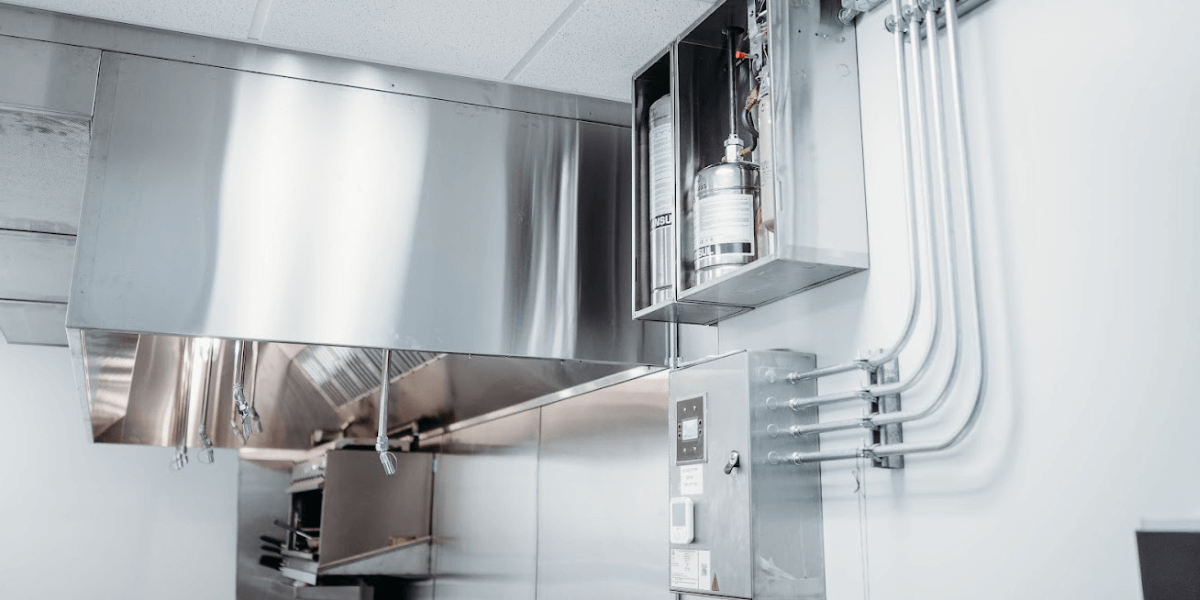 A fire suppression system installed in an industrial kitchen